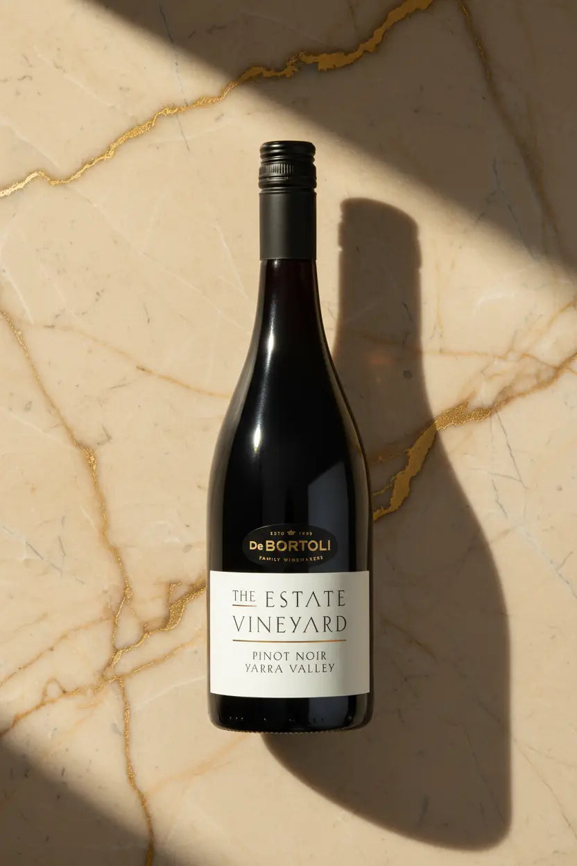 De Bortoli The Estate Vineyard Pinot Noir 2025 bottle on gold-veined marble surface, Yarra Valley
