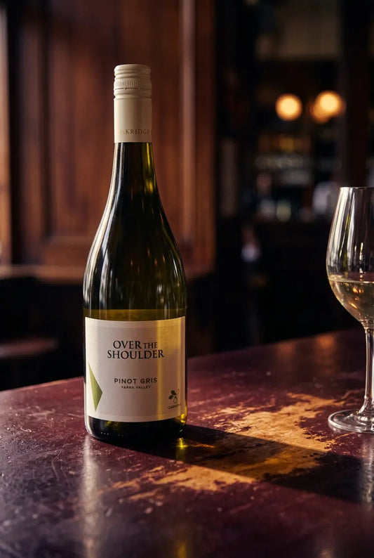 Oakridge Over The Shoulder Pinot Gris bottle on a warmly lit restaurant table