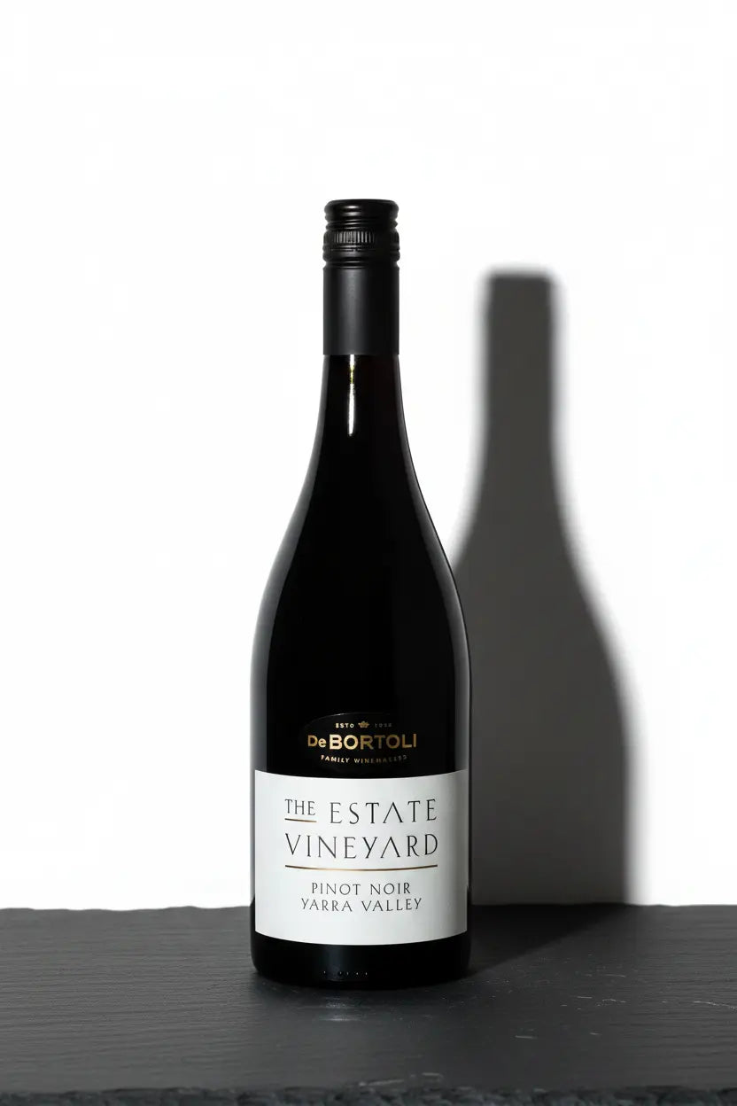 De Bortoli The Estate Vineyard Pinot Noir 2025 bottle on dark charcoal slate surface, Yarra Valley